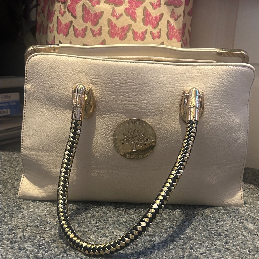 Mulberry Elegant Cream Handbag with Gold Accents and sturdy handle
